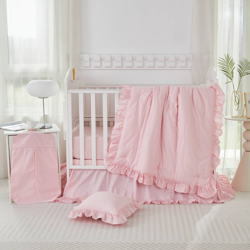 A pink fadfay crib bedding set