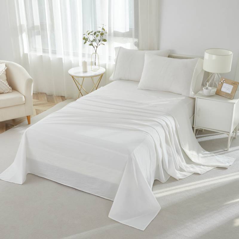 This bedroom features a Brandream four-piece bedding sheet Set.