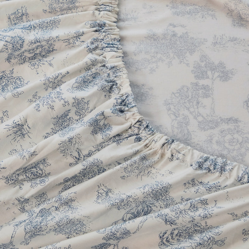 Floral-patterned mattress cover on a bed in a bedroom setting