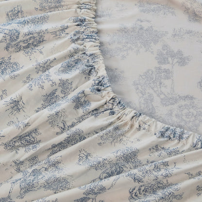 Floral-patterned mattress cover on a bed in a bedroom setting
