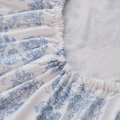 Floral-patterned mattress cover on a bed in a bedroom setting