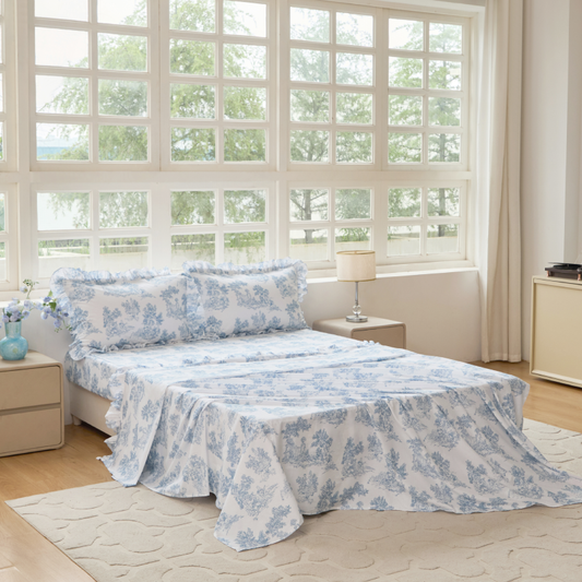 Bed with green floral patterned bedding in a bedroom setting