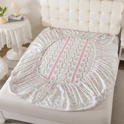 Floral-patterned mattress cover on a bed in a bedroom setting