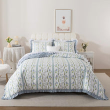 Neatly made bed with white comforter in a bright bedroom setting