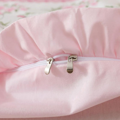 Close-up of a zipper on a floral-patterned fabric with a soft focus background.