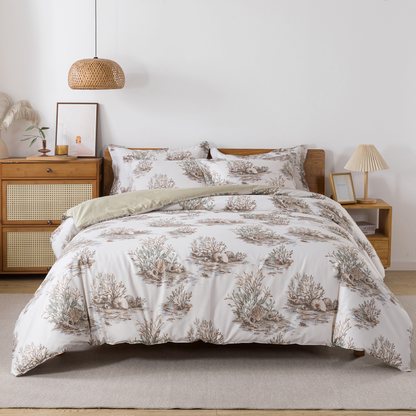 Neatly made bed with white comforter in a bright bedroom setting