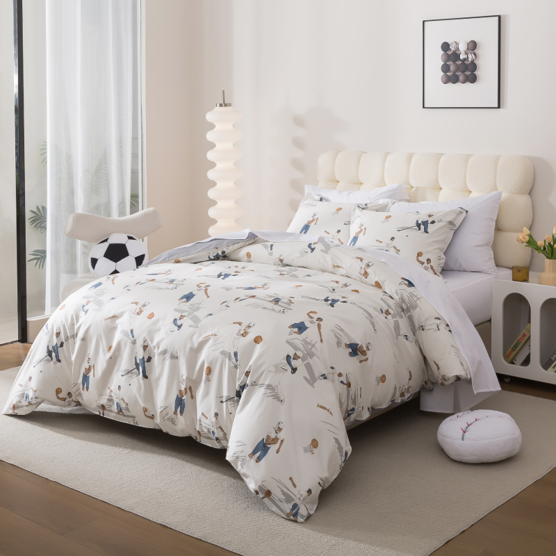 Bedroom with floral-patterned bedding and a plant