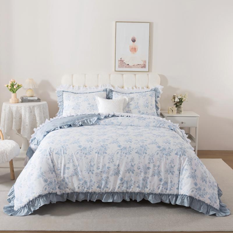 Neatly made bed with white comforter in a bright bedroom setting