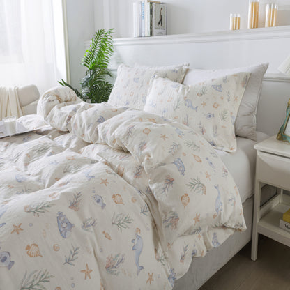 Bed with floral and animal patterned bedding in a bright bedroom.
