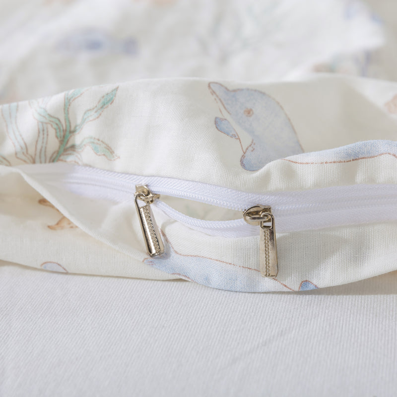 Close-up of a zipper on a baby blanket with animal patterns.