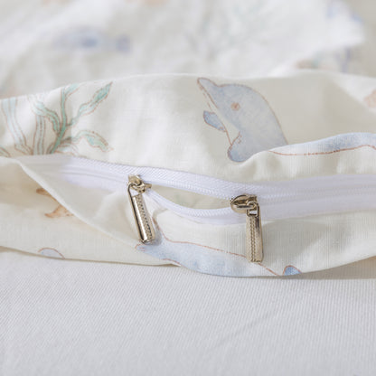 Close-up of a zipper on a baby blanket with animal patterns.