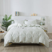 Neatly made bed with white bedding in a bright bedroom setting.